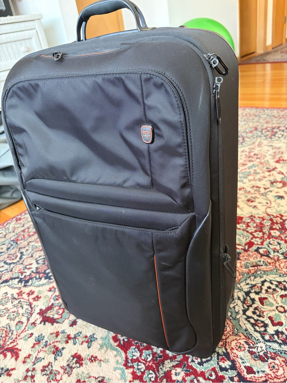 T-Tech by TUMI Carry-On Rolling Suitcase – Black – Orange Interior